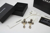 CH Flower And CC Logo Metal Dore Earrings